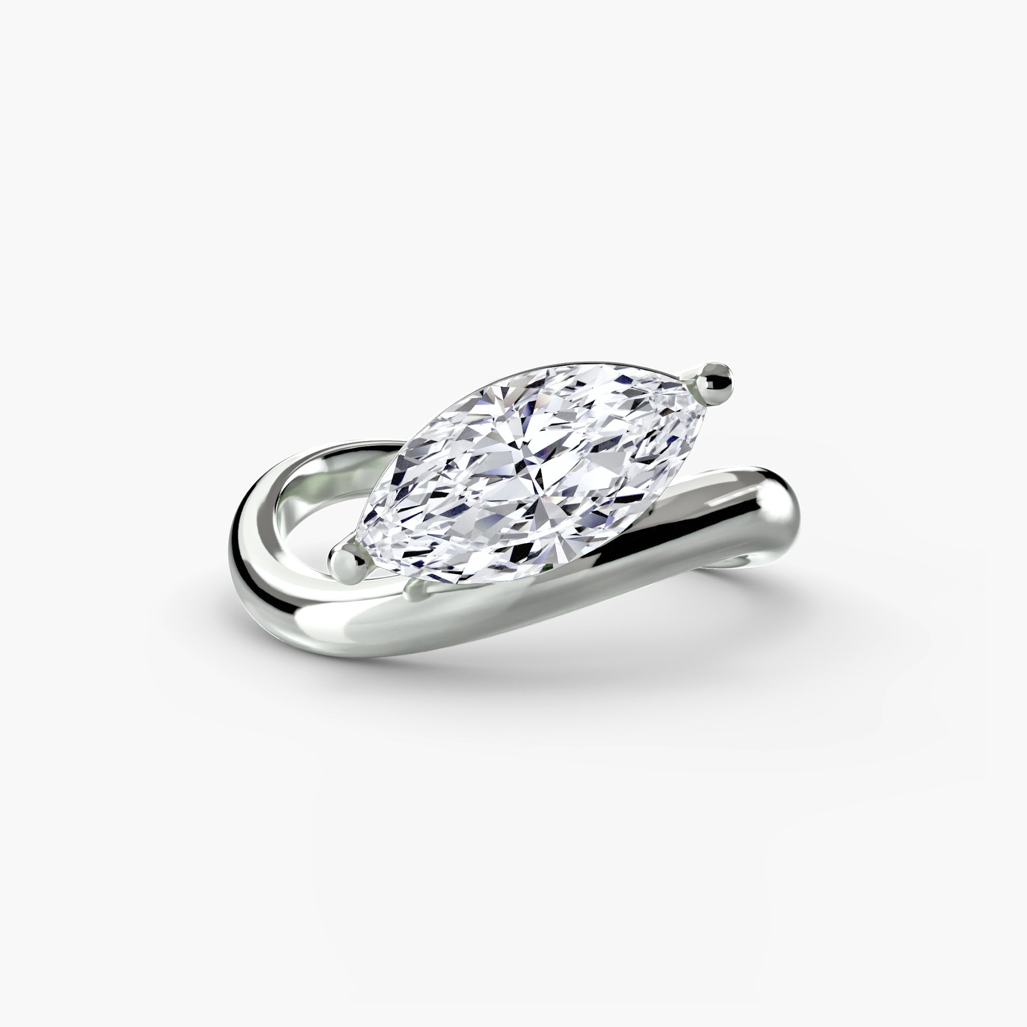 Diamond ring with a pear-shaped gemstone on a white background