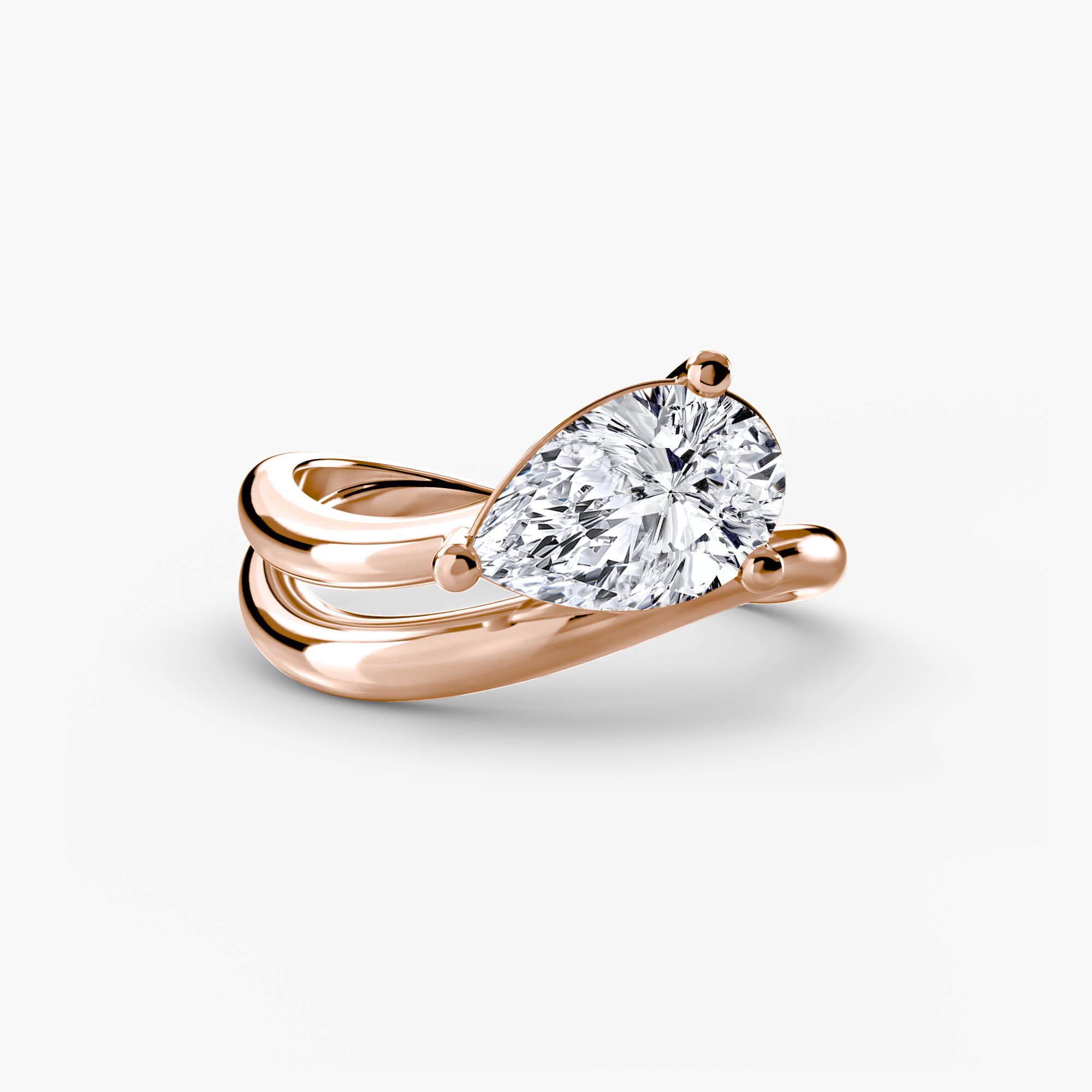 Rose gold ring with a large diamond on a light gray background